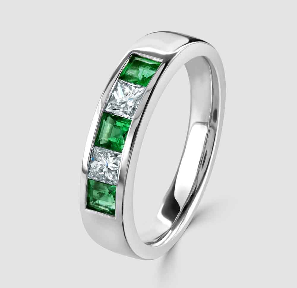 Platinum emerald and diamond five stone ring