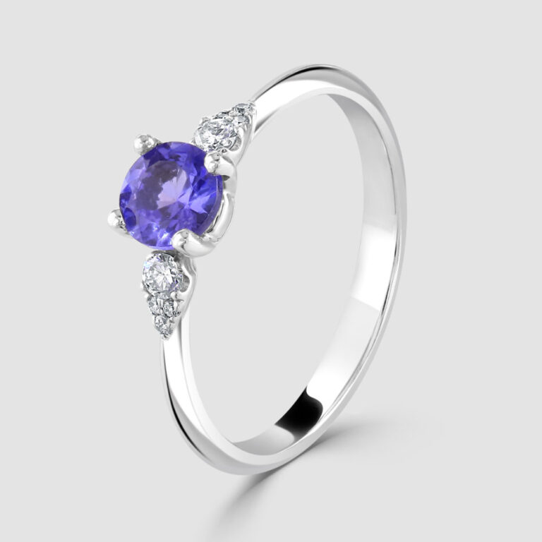 18ct white gold, tanzanite with pear shape diamond shoulders
