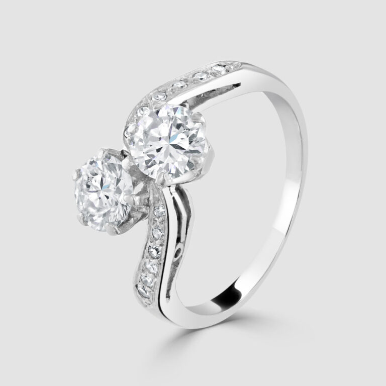 Platinum crossover with diamond shoulders ring