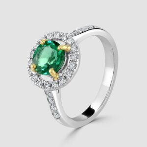 Platinum emerald and diamond halo ring