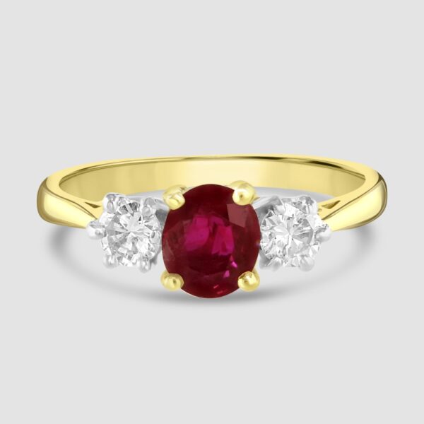 Ruby and diamond claw set three stone ring