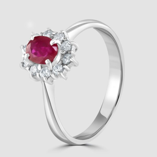 Oval claw set ruby and diamond cluster ring