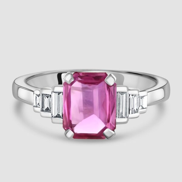 Pink sapphire and stepped baguette cut diamond ring