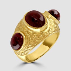 Etruscan style garnet three stone ring
