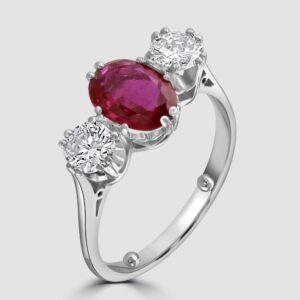 Ruby and diamond claw set three stone ring