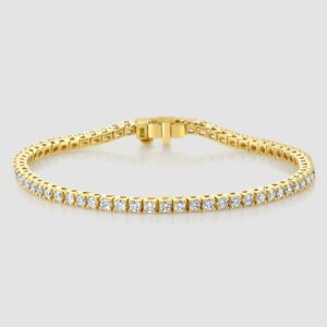 Laboratory diamond claw set line bracelet in yellow gold - small