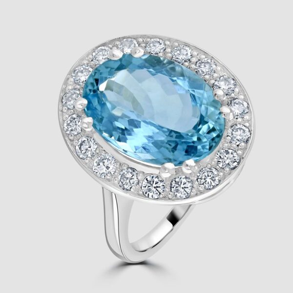 Oval aquamarine and diamond cluster ring